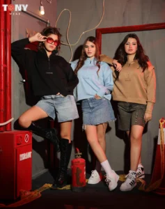 Imported Medical Half-Zip Sweatshirt in Black Blue and Camel worn by models with denim